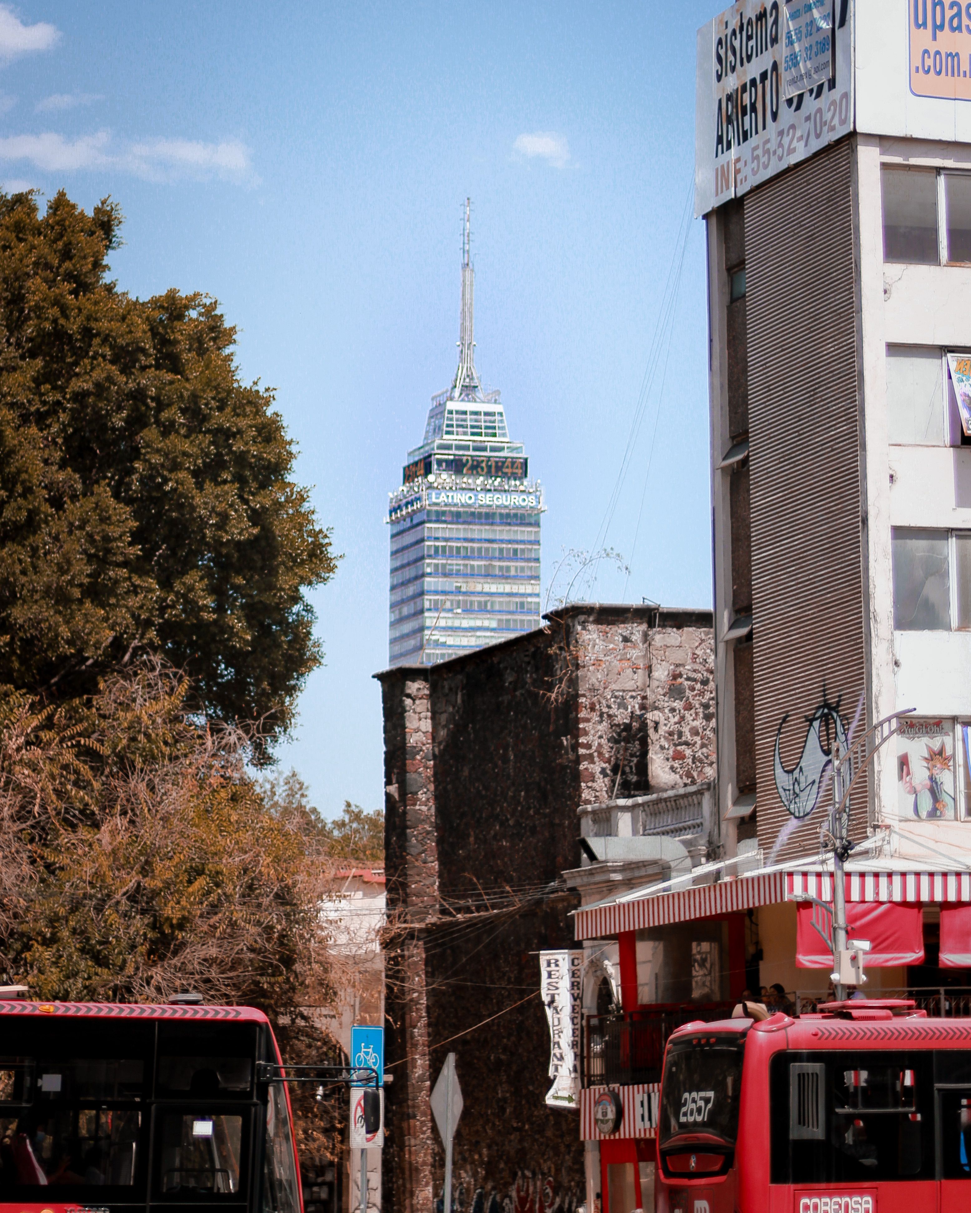 Torre Latinoamericana behind Buildings in Mexico City · Free Stock Photo