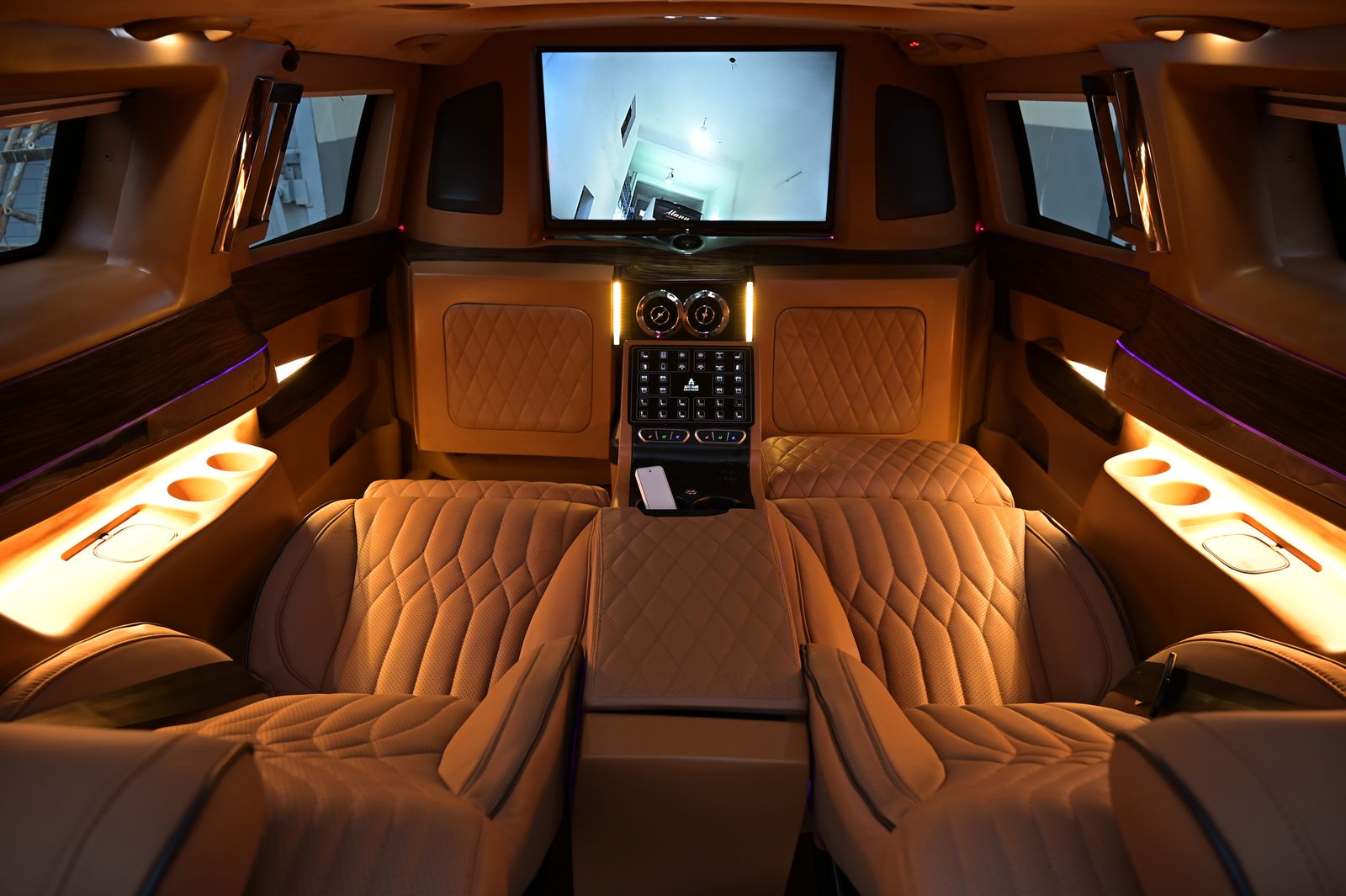 Luxury party bus interior with LED lighting and leather seating