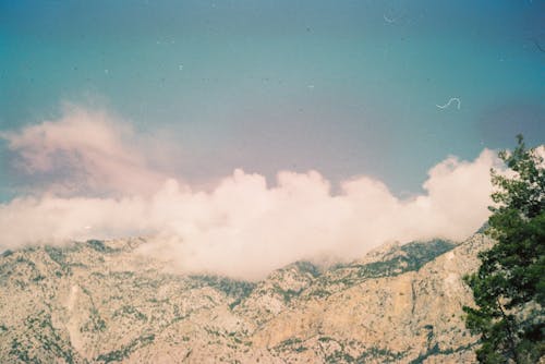 Clouds Covering the Peak of Rocky Mountains 