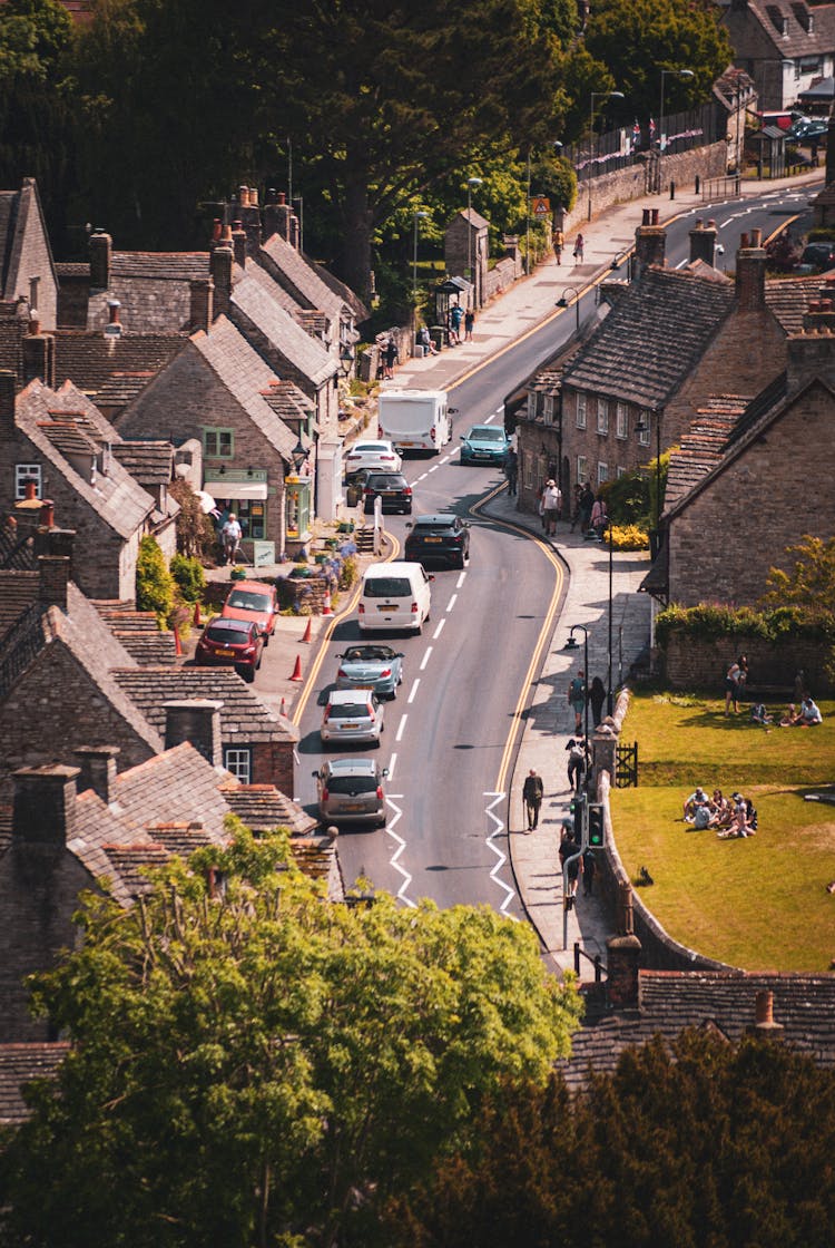 Cars On Street In Village In UK