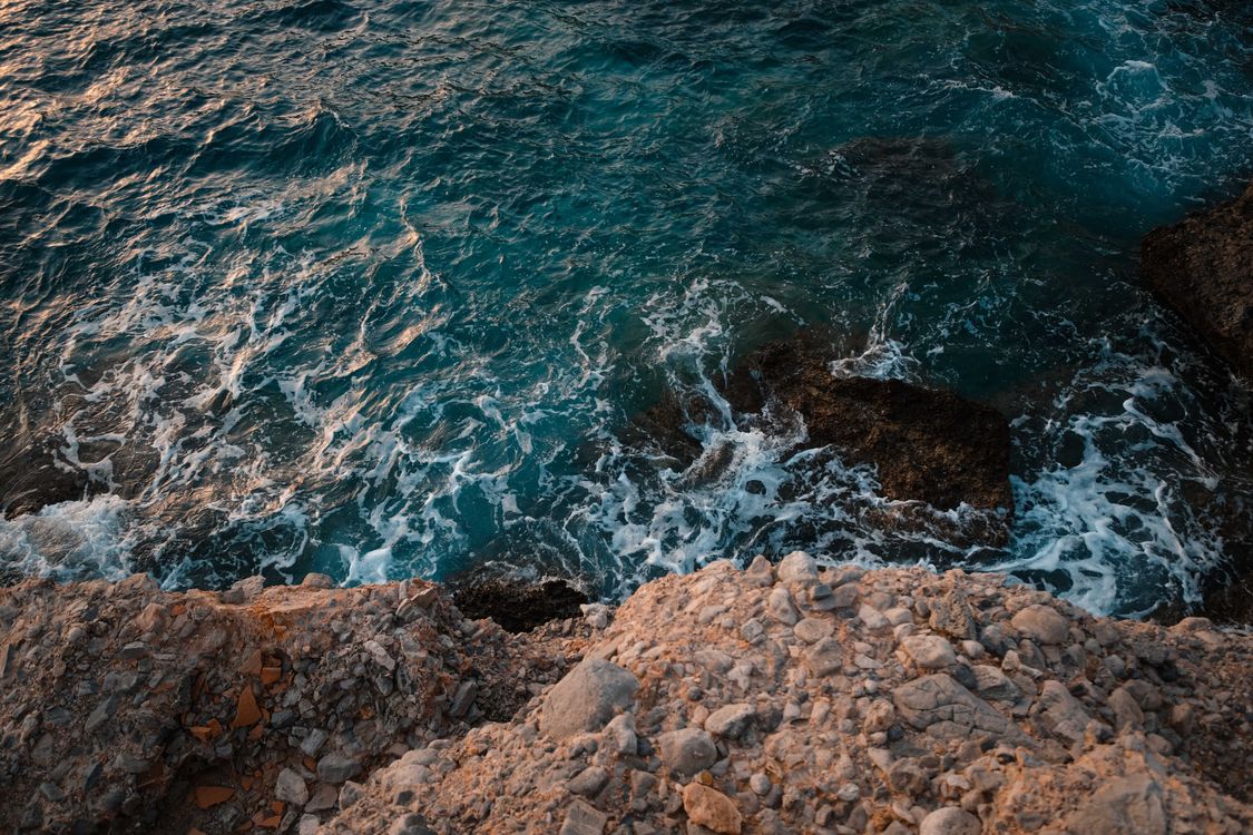 Shore Rocks Intense Rocks on Sea Shore · Free Stock Photo