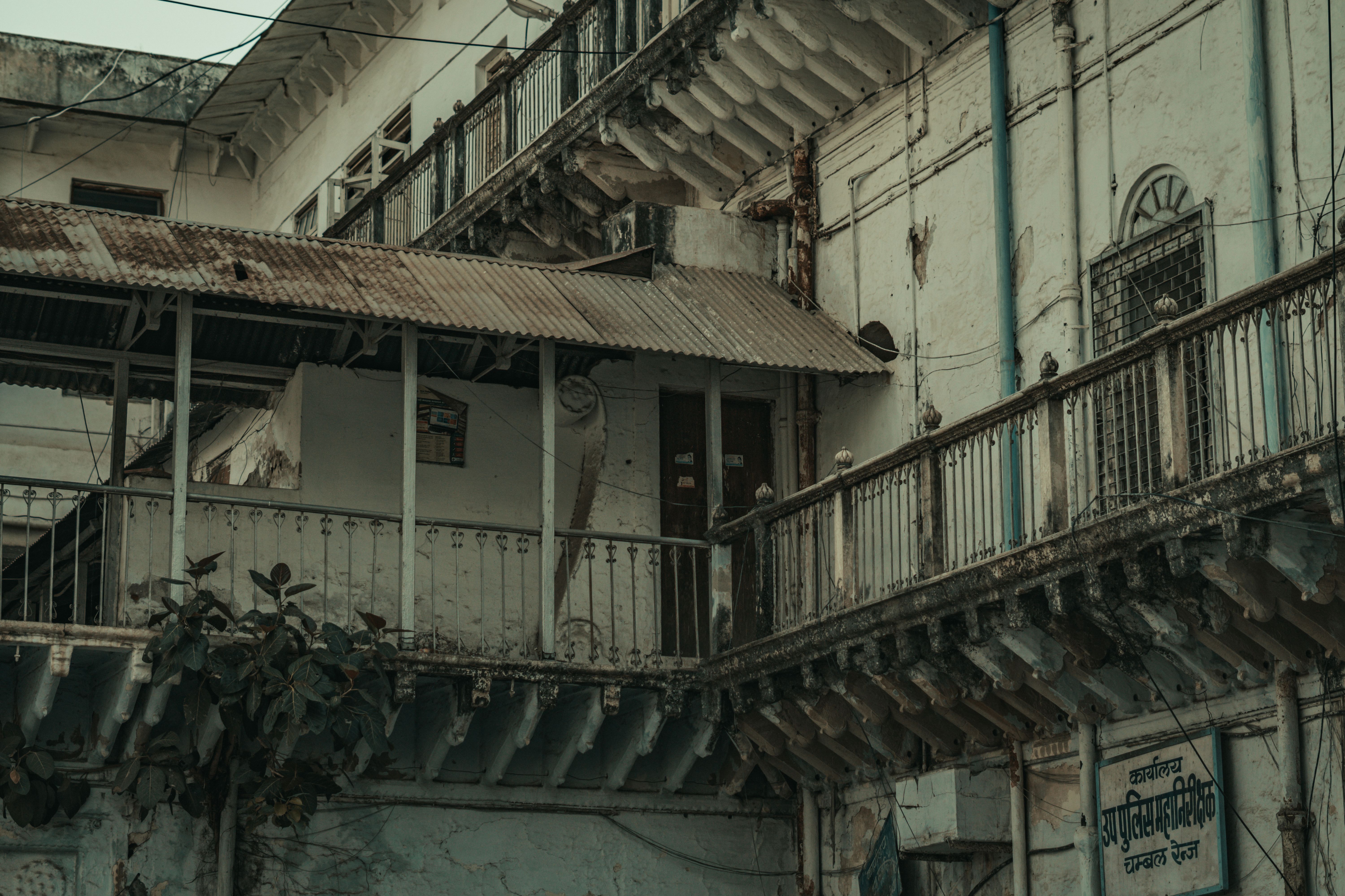A decaying urban building facade showcasing architectural neglect and heritage decay in India.