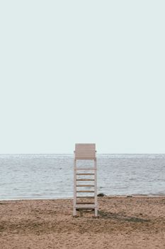 Serene beach view with an empty lifeguard chair by the sea in Mersin, Türkiye.