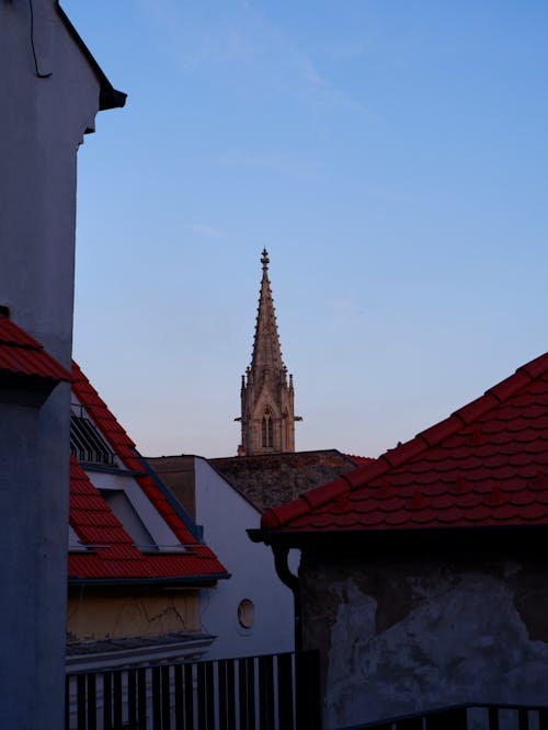 Gothic Church Tower over Rooftops
