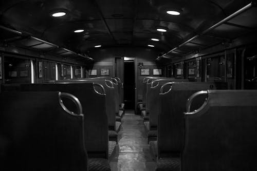 Grayscale Photography of Train Car Interior