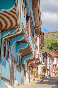 Colorful Ottoman-style houses on a charming street in Amasya, Türkiye, showcasing historical architecture.
