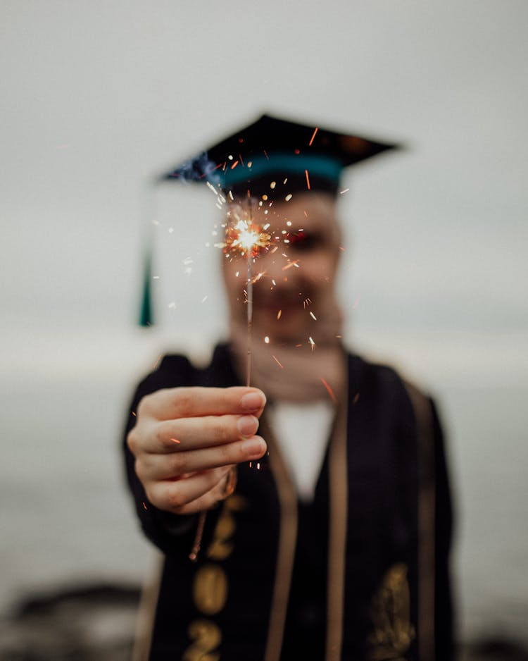 Sparkler In Graduate Hand