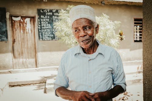 Elderly Man in Shirt and Traditional Hat
