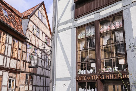 Explore the charm of a historic café in Quedlinburg's old town with half-timbered buildings.