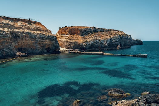 A captivating coastal scene of Gozo's cliffs with crystal-clear blue waters, perfect for travel inspiration.
