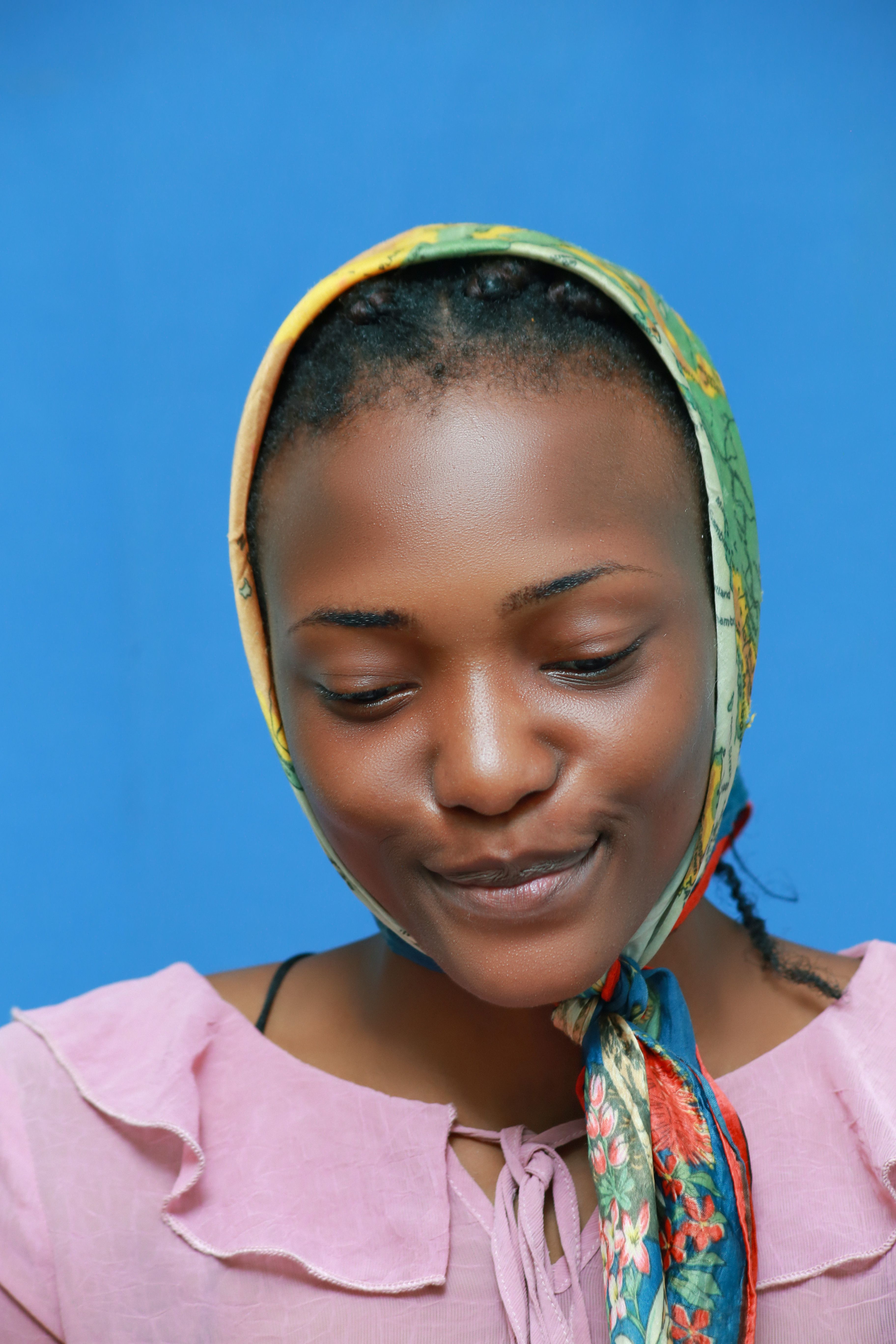 Portrait of Woman in Colorful Headscarf on Blue Back · Free Stock Photo