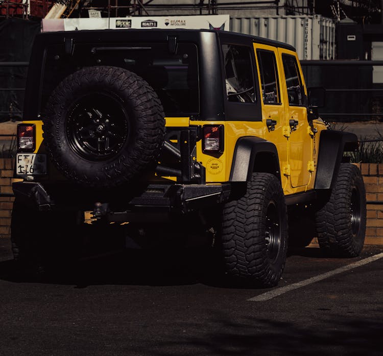 Back Of Yellow Jeep Wrangler