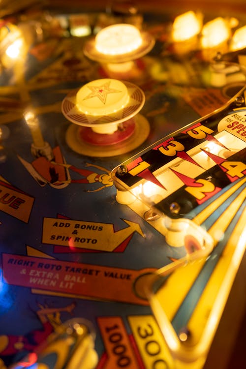Close-up of Illuminated Elements of an Arcade Machine 