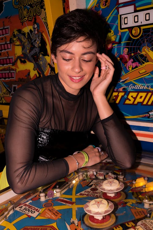 Woman in Front of Arcade Game in a Casino 