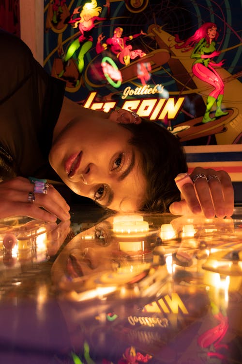 Woman Posing on Arcade Game 