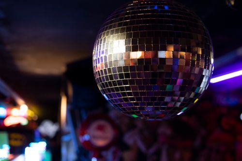 Free Glittering disco ball in a vivid nightclub, capturing the essence of nightlife and celebration. Stock Photo