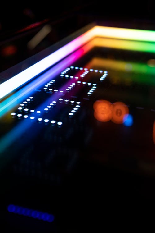 Close-up of Illuminated Elements of an Arcade Machine