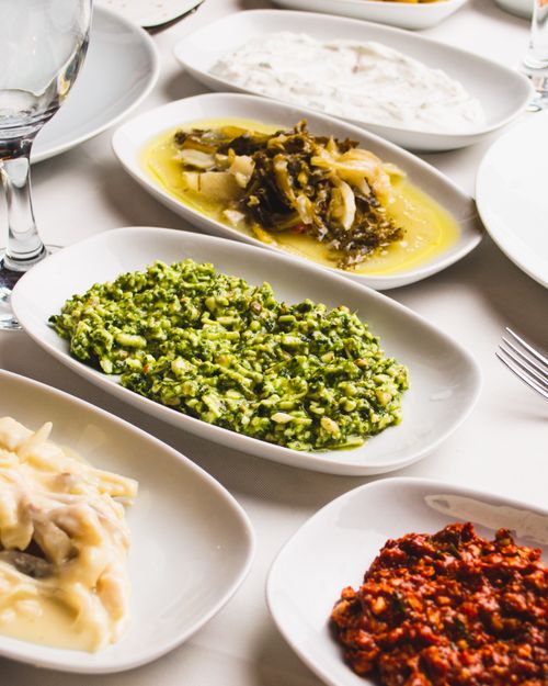 Free A vibrant assortment of Mediterranean meze dishes arranged on a table, showcasing diverse flavors and colors. Stock Photo