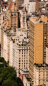 High-angle view of New York City's towering skyscrapers bathed in sunlight.