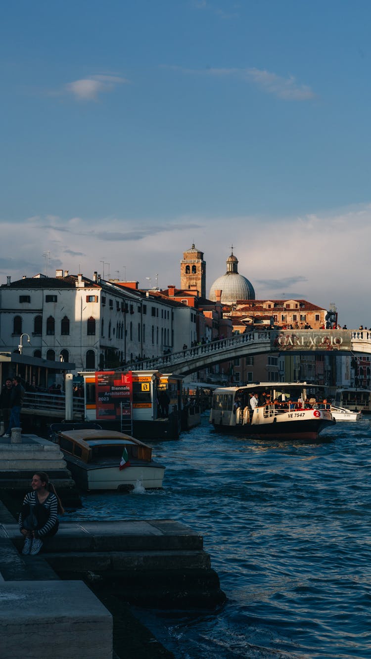 View Of Boats On The Canal And The Dome Of The San Geremia Church And A Bell Tower In The Background, Venice, Italy 