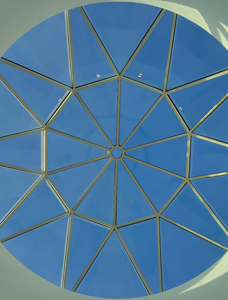 A Glass Ceiling With A Geometric Pattern 