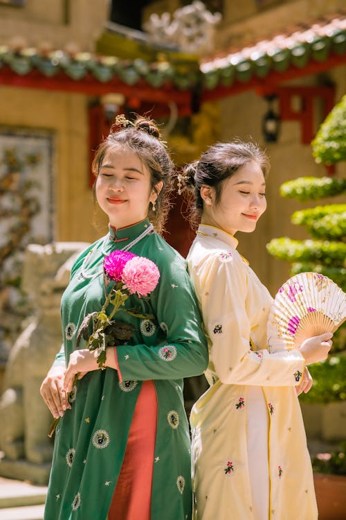 Women Posing in Traditional Clothing