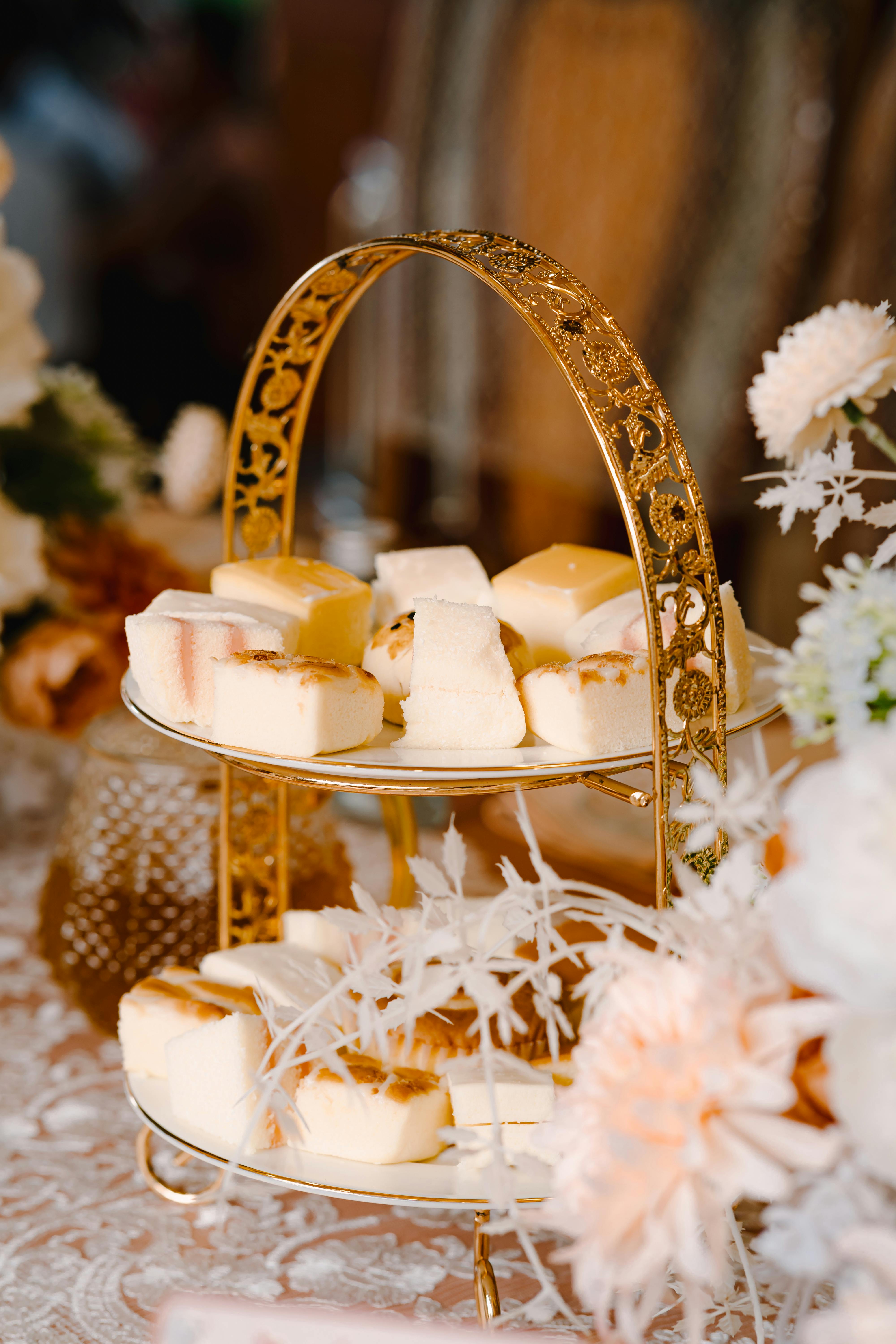 sweet cakes on decorative stand