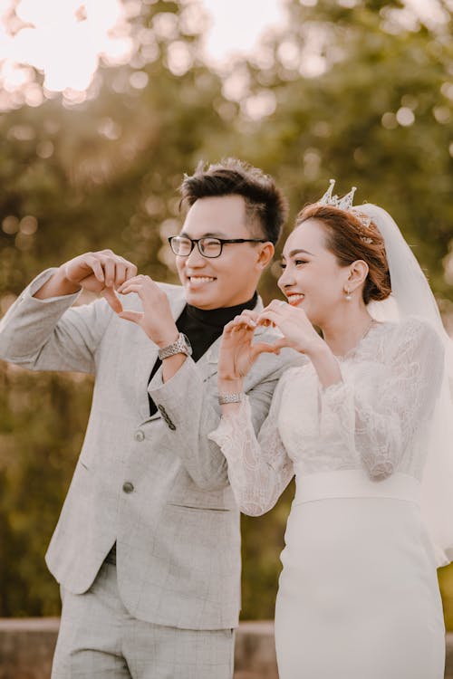 Smiling Newlyweds Standing and Posing Together