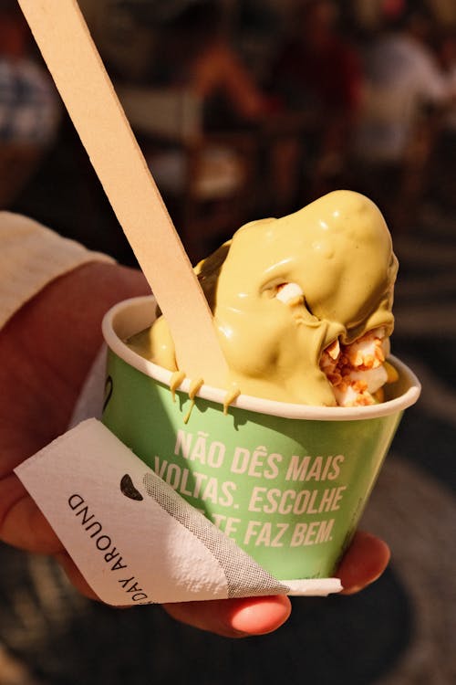 Close-up of a Person Holding a Cup with Ice Cream 