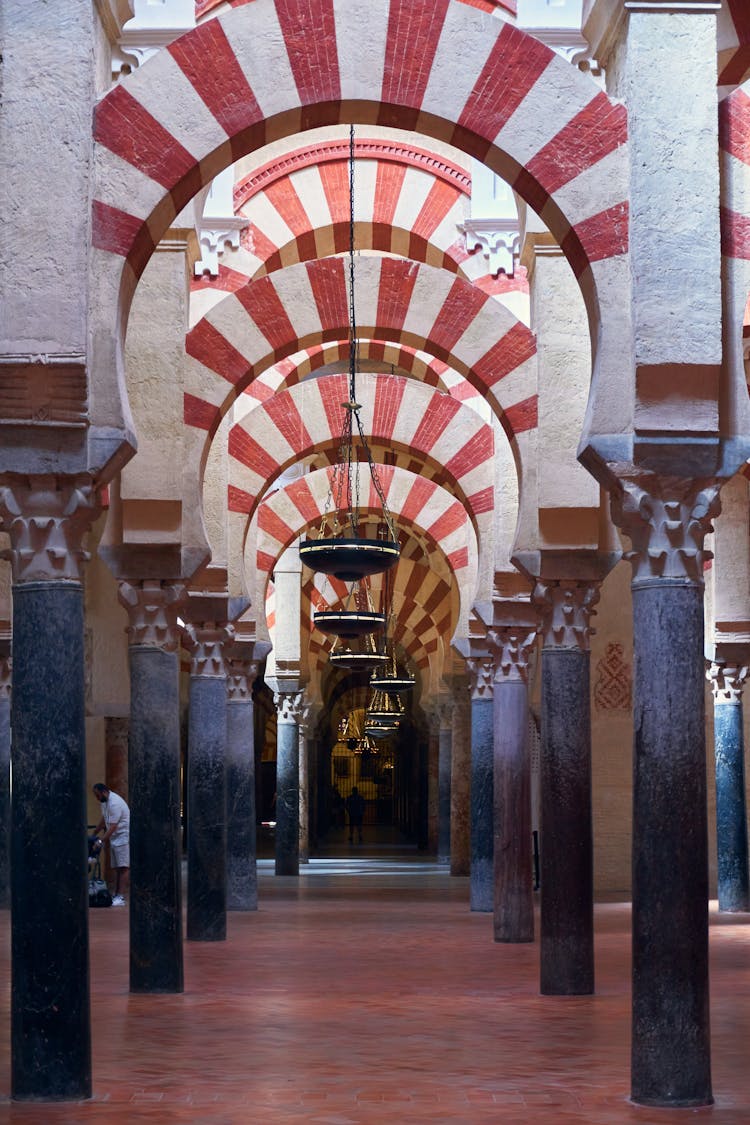 Arches And Columns Inside The Mezquita In Cordoba, Spain 