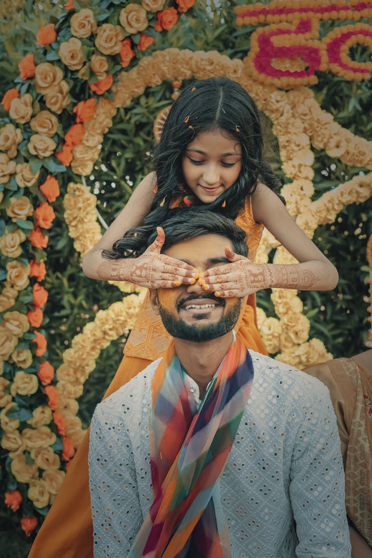 Girl Putting Paint On Man Face On Traditional Wedding Ceremony