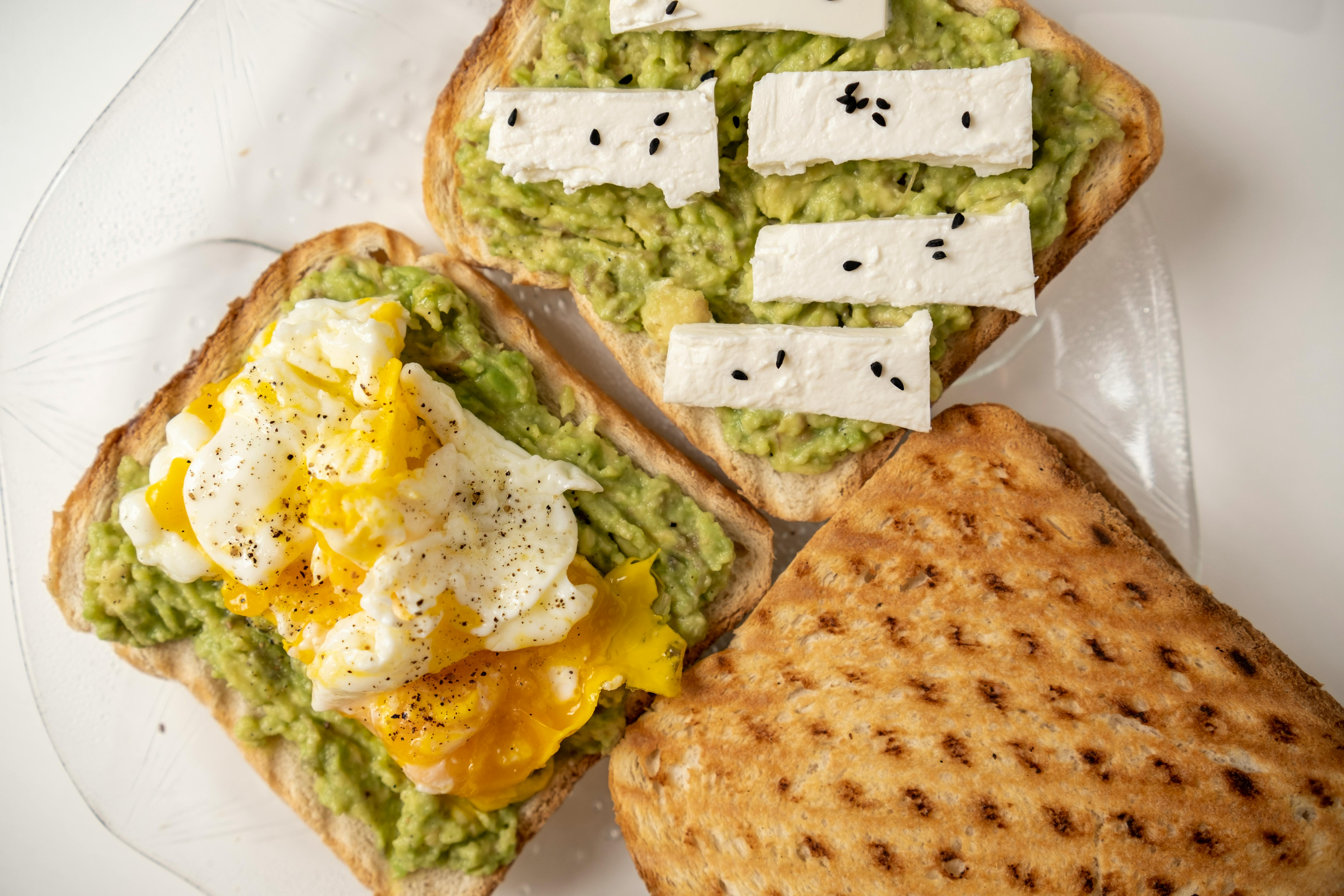 various toppings for savory oatmeal, including cheese, avocado, sesame seeds, and chili oil