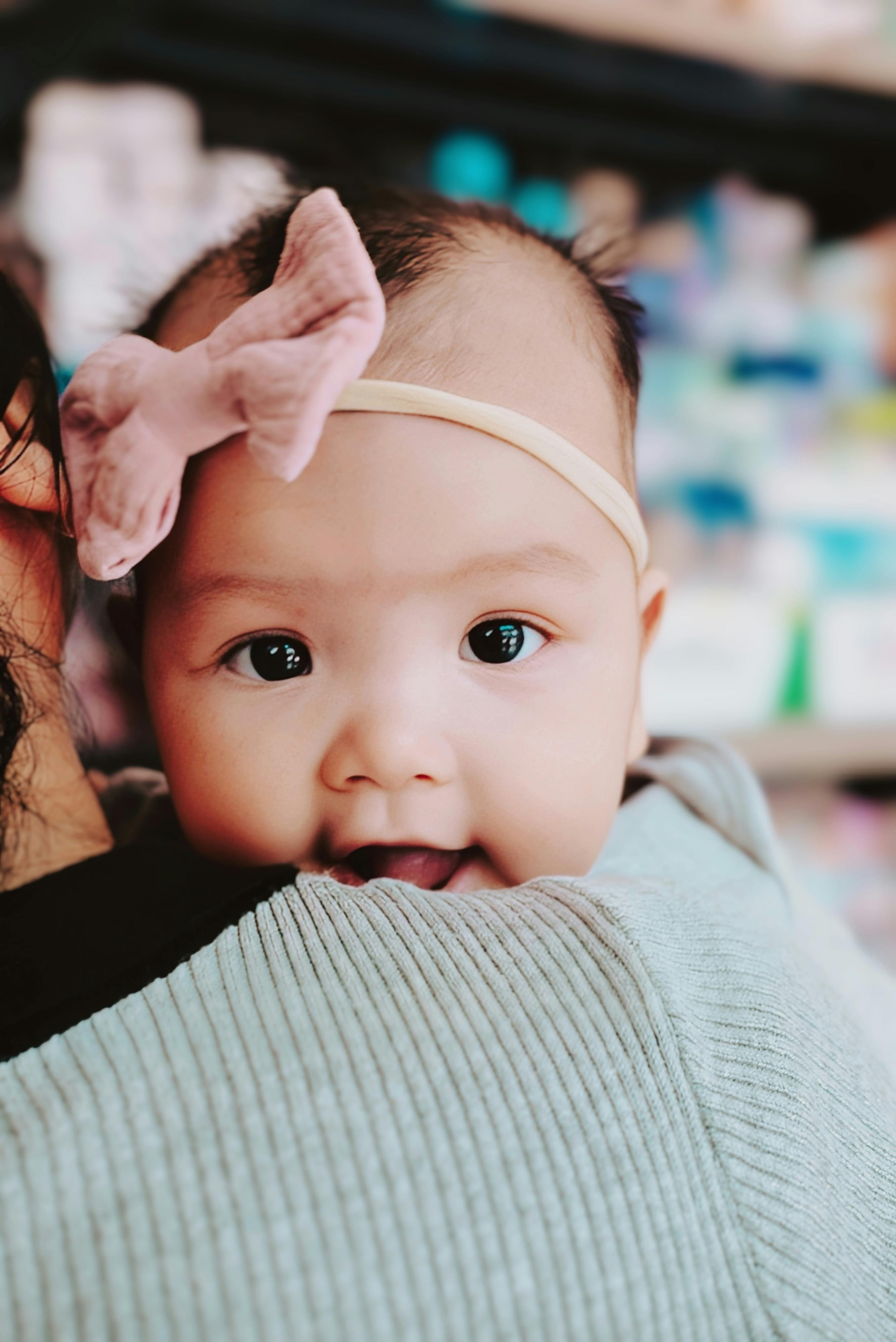 mother holding baby daughter