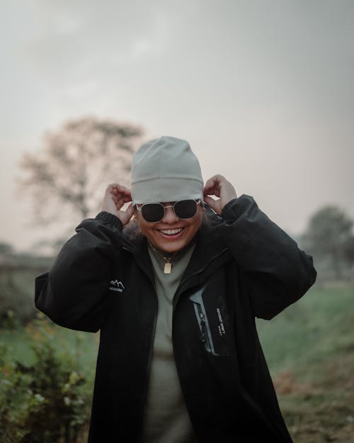 Smiling Man in Hat and Sunglasses