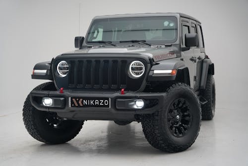 Free A sleek and powerful off-road SUV showcased in a minimalist studio setting, highlighting its rugged design. Stock Photo