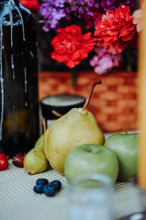 Free Colorful arrangement of fresh fruits and flowers on a table, enhanced with natural light. Stock Photo