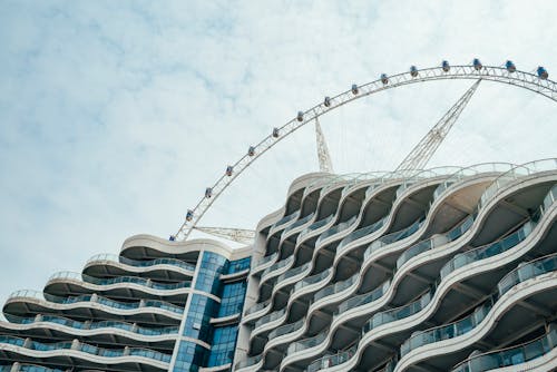 Ferris Wheel over Modern Residential Building