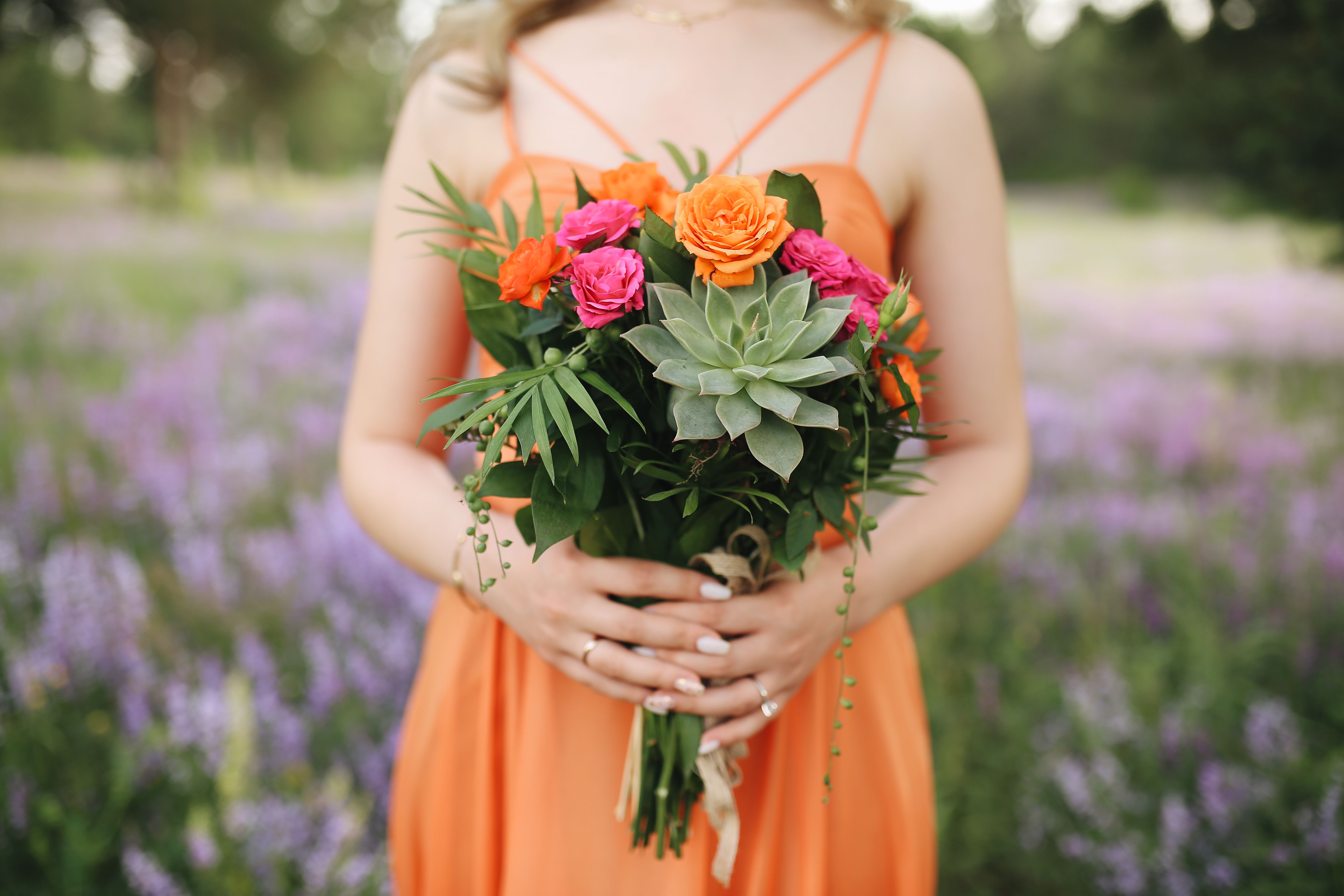 Woman Holding a Bouquet of Flowers · Free Stock Photo