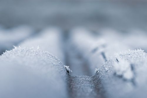 Free A detailed close-up shot of frost covering a cold roof surface during wintertime. Stock Photo
