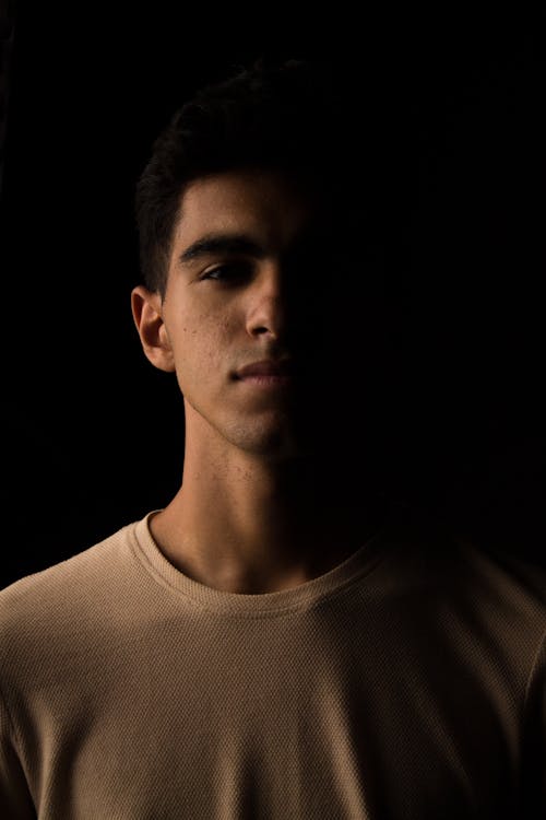 Dark Studio Shot of a Young Man 