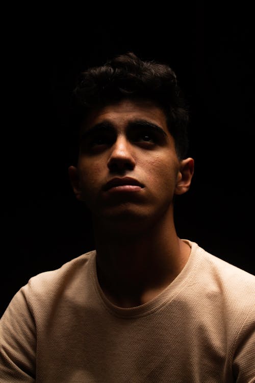 Dark Studio Shot of a Young Man 