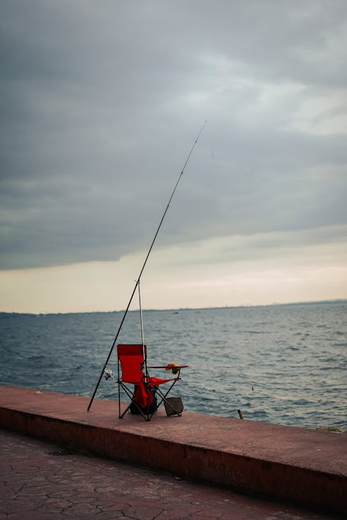 Fishing Rod and Chair on Sea Shore