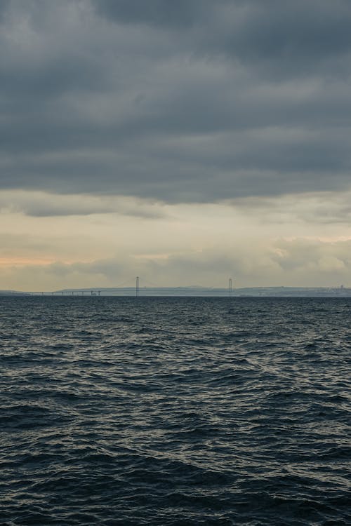 View of the Sea and a Bridge in Distance 