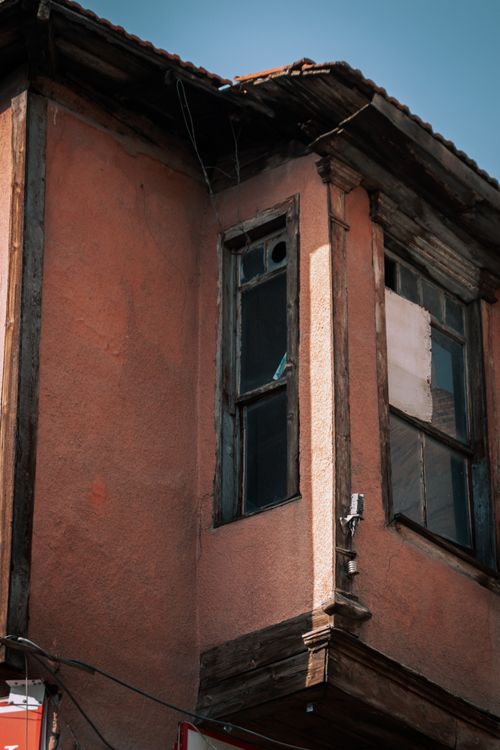 Free Close-up of an abandoned house exterior with broken windows highlighting traditional Turkish architecture. Stock Photo