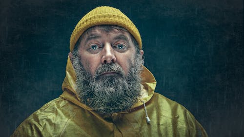 Man with Beard and in Raincoat