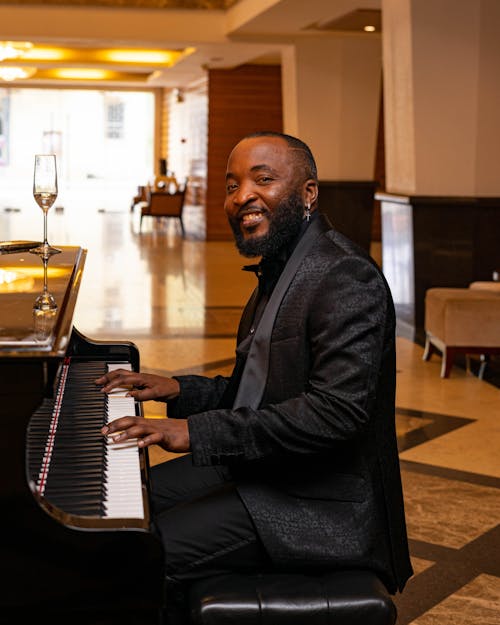 Smiling Man Playing Piano