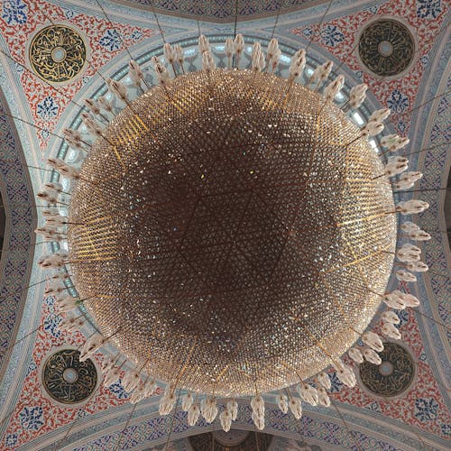 A Crystal Chandelier and a Mosaic Dome in a Mosque 