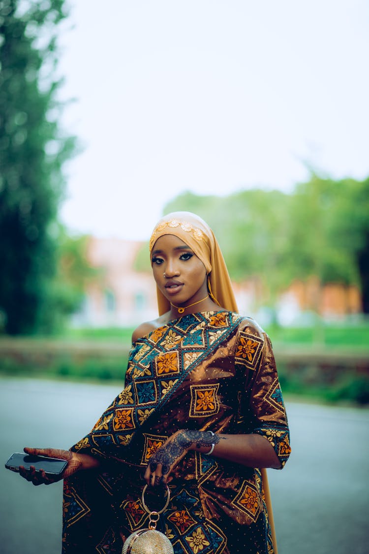 Young Woman Wearing A Traditional Gown And A Headscarf 