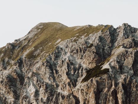 Aerial view of rugged rocky mountains in Triesenberg, showcasing natural beauty and erosion.