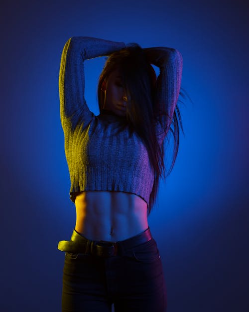 Color light portrait of fitness girl